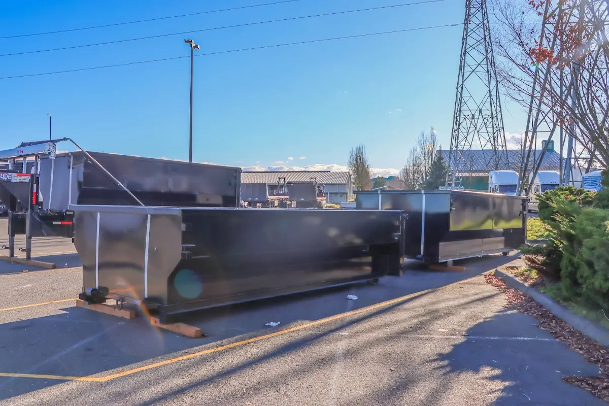 Roll-off dumpster ready for waste disposal at job site for 15 Yard Dumpster Rental in Adel